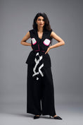 Load image into Gallery viewer, BLACK CO-ORD SET WITH NEON GEOMETRIC PANELLED SLEEVELESS BLAZER, TWISTED TOP AND TROUSERS