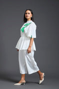 Load image into Gallery viewer, White Smocked Floral Peplum Top
