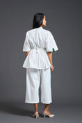Load image into Gallery viewer, White Smocked Floral Peplum Top
