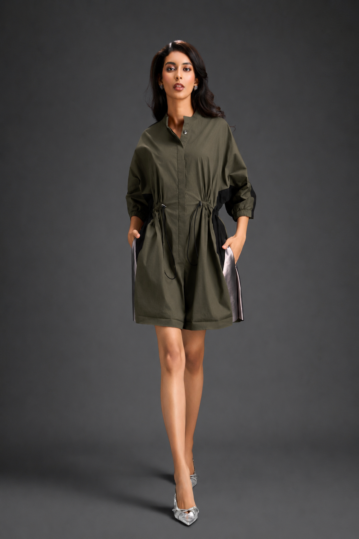 Dark Green Shirt Romper With Drawstring Waist, Black Details, And Metallic Side Panels