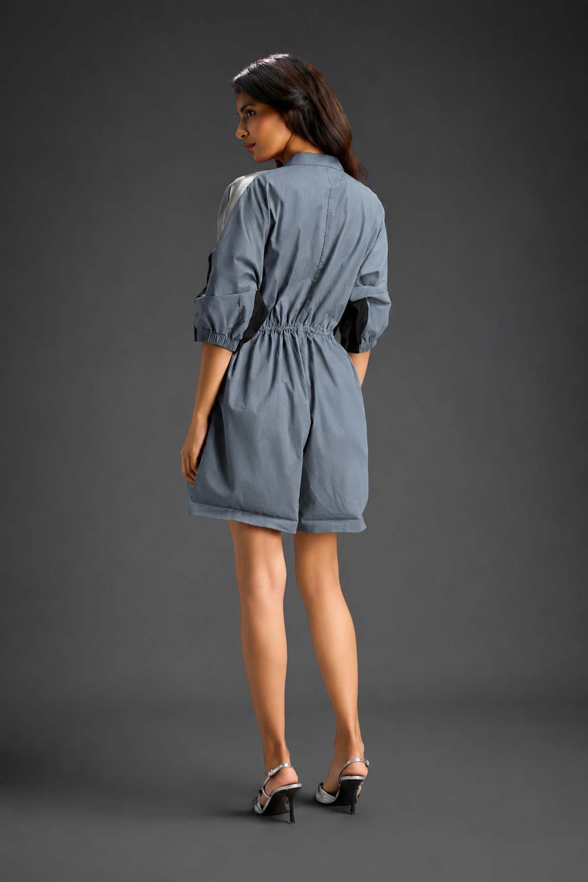 Cool Grey Shirt Romper With Drawstring Waist, Black Details, And Metallic Side Panels