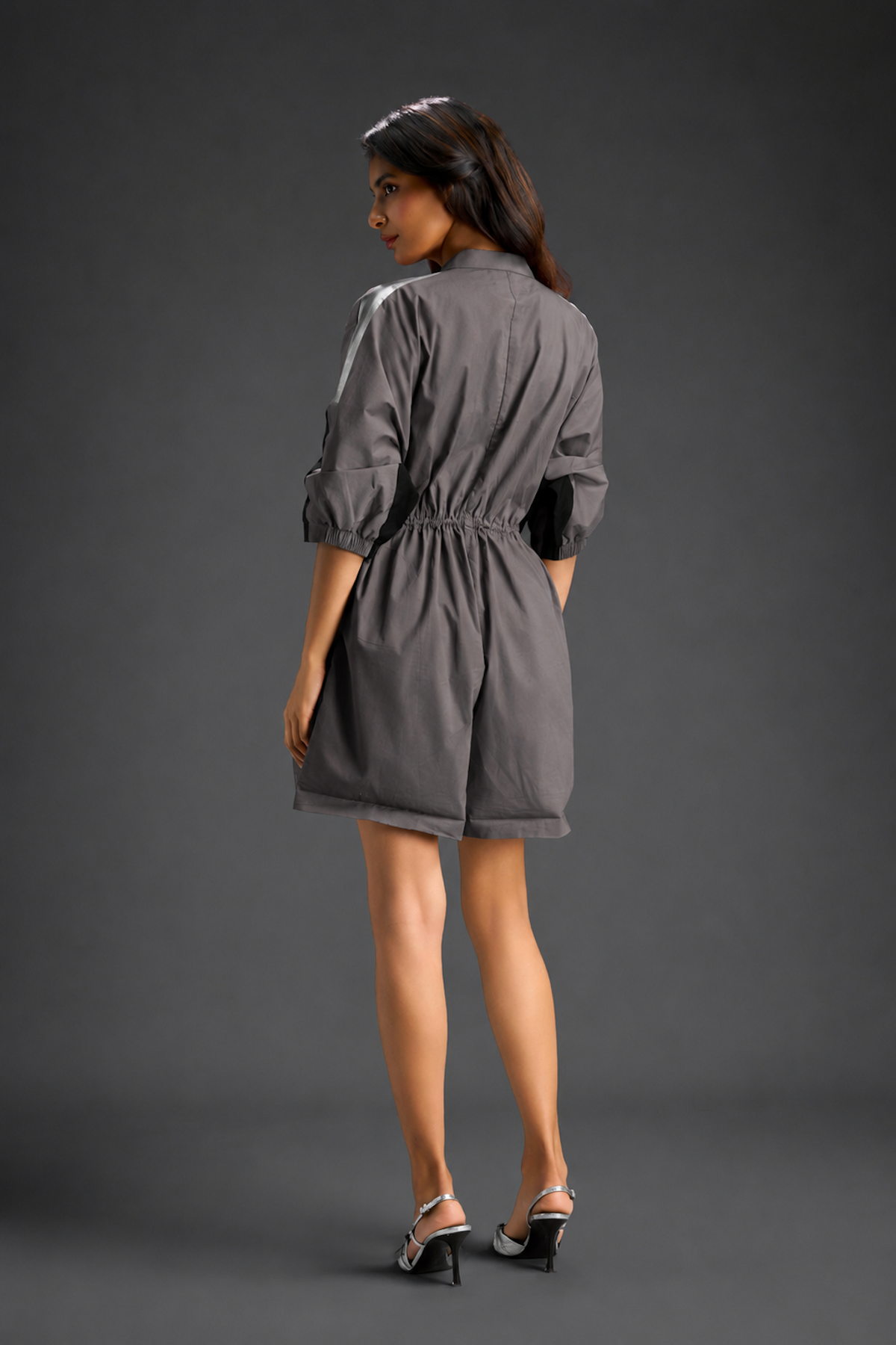 Warm Grey  Shirt Romper With Drawstring Waist, Black Details, And Metallic Side Panels