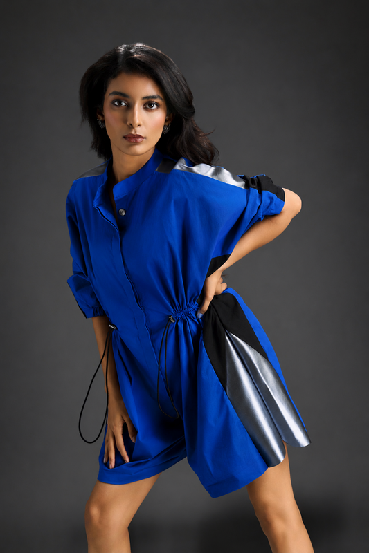 Blue Shirt Romper With Drawstring Waist, Black Details, And Metallic Side Panels