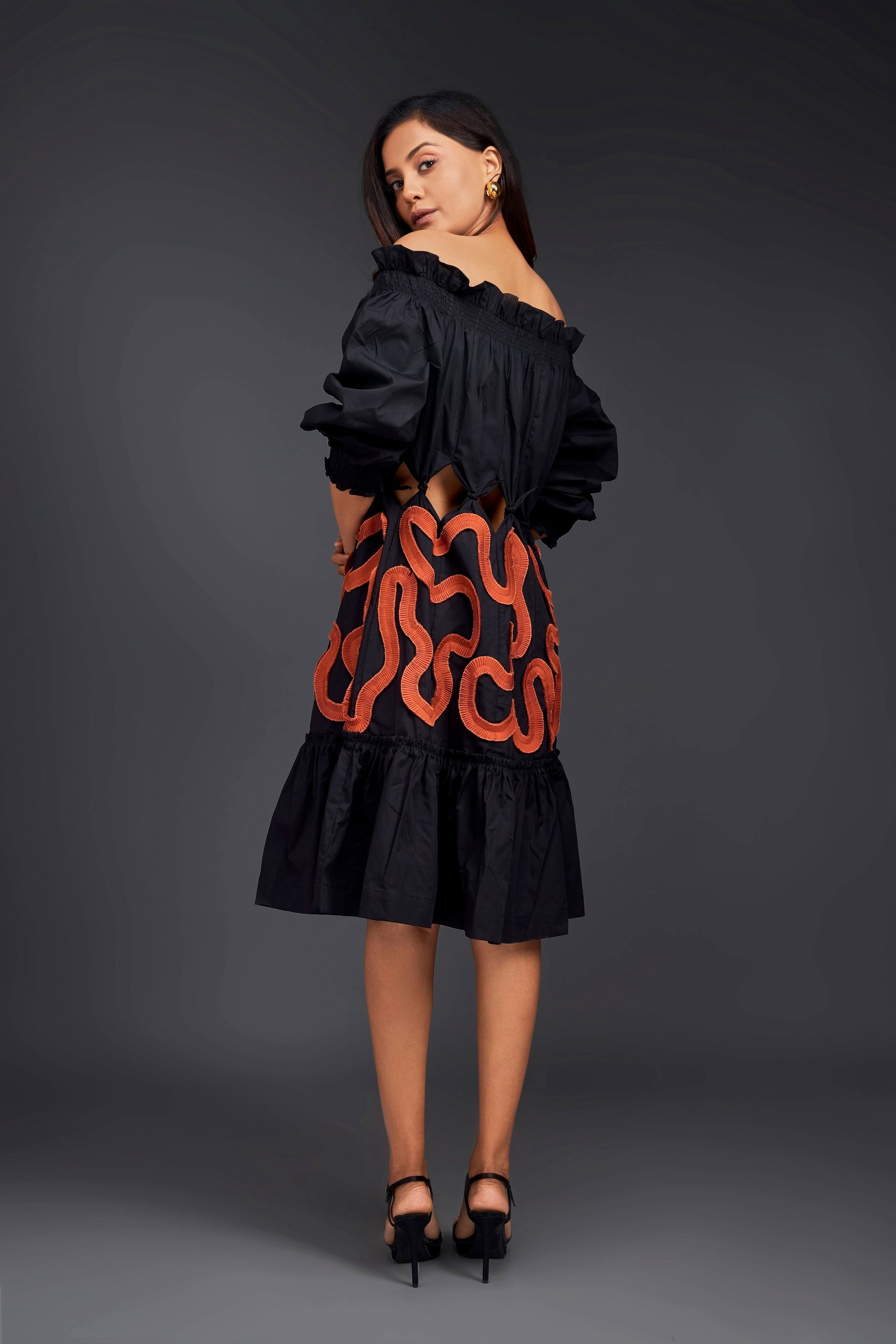 Black Off-Shoulder Dress With Waist Cutouts And Pleated Frill Detailing