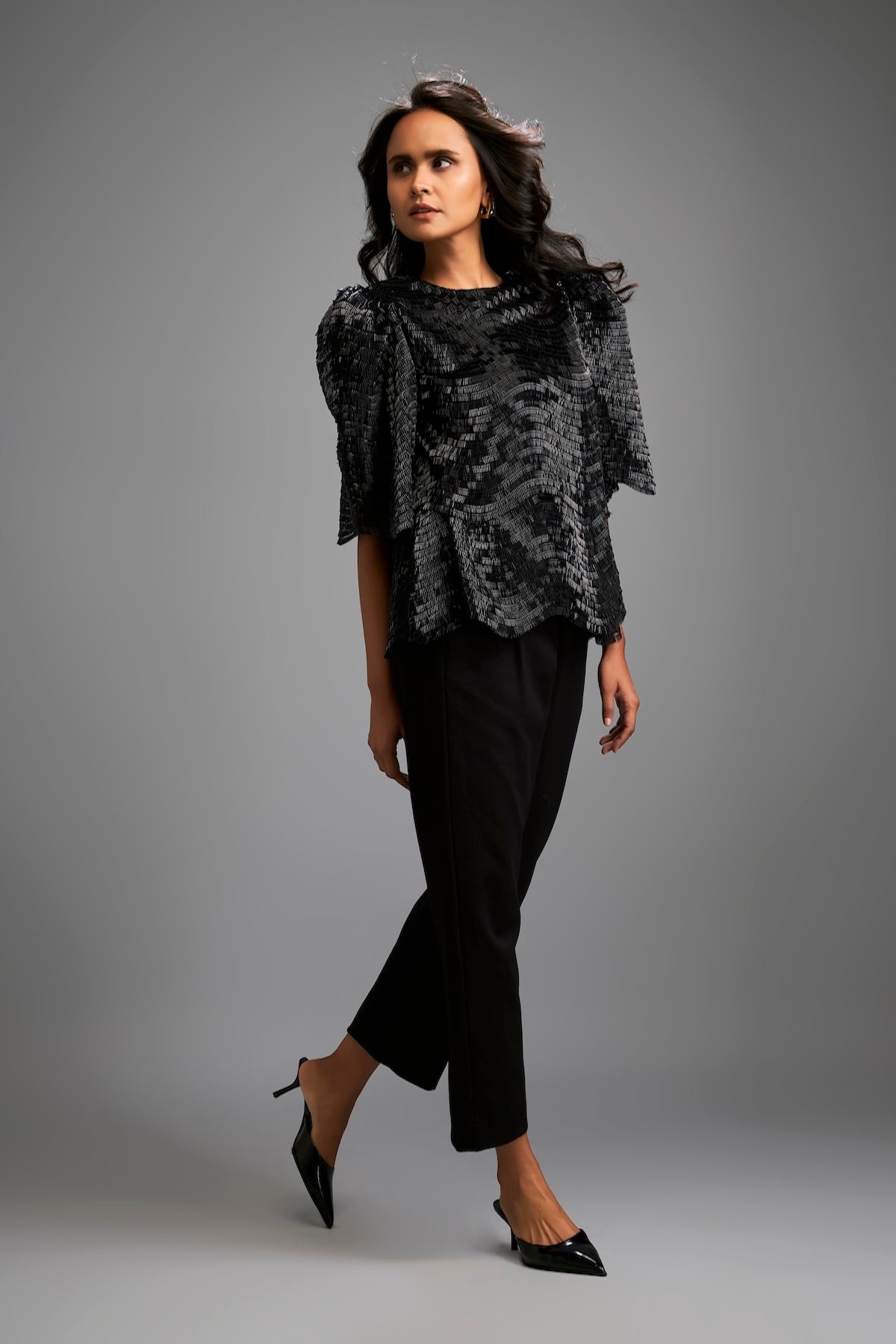 Textured Black Shimmer Top with Sculptural Shoulders and Cropped Pants