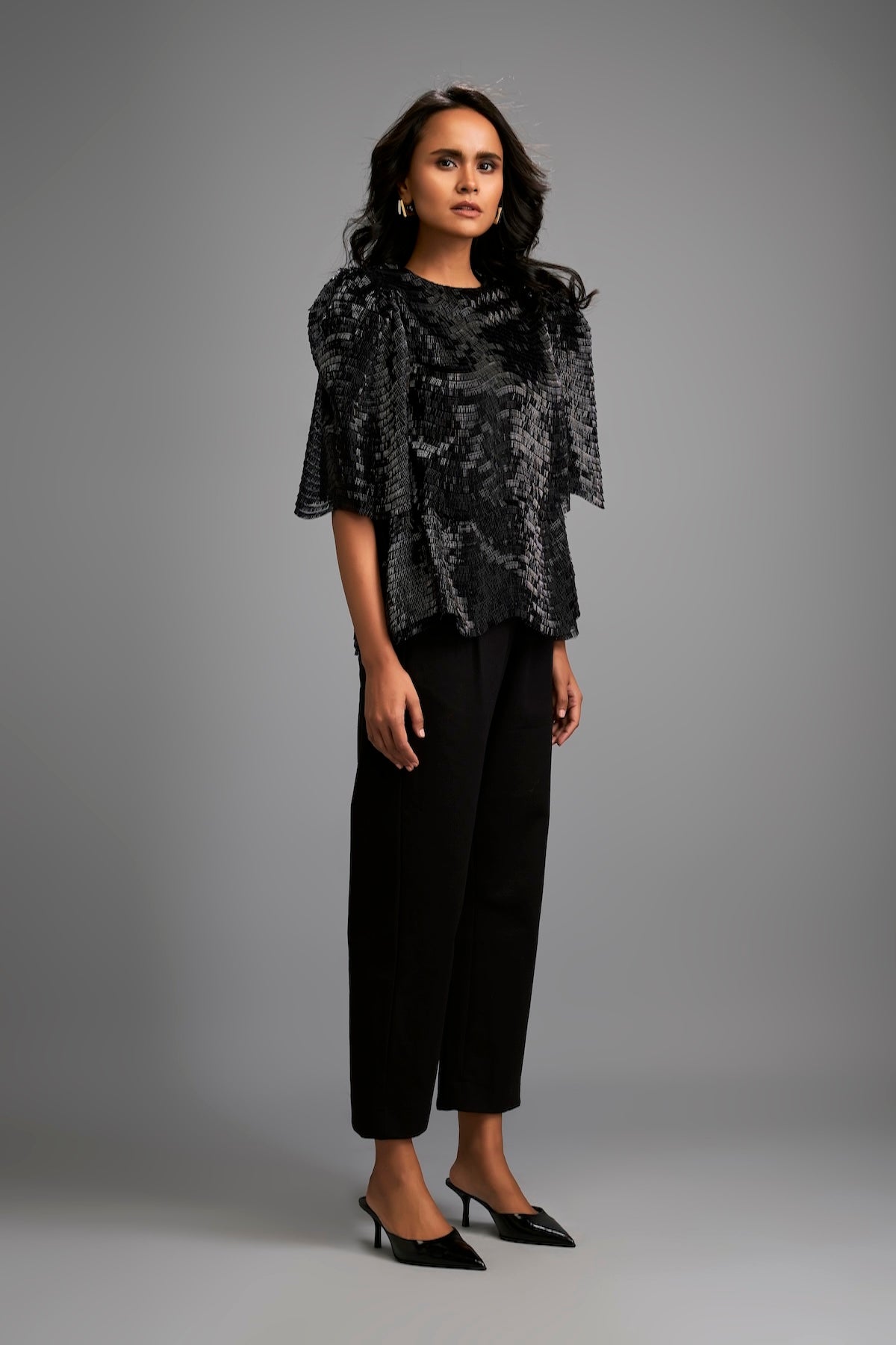 Textured Black Shimmer Top with Sculptural Shoulders and Cropped Pants