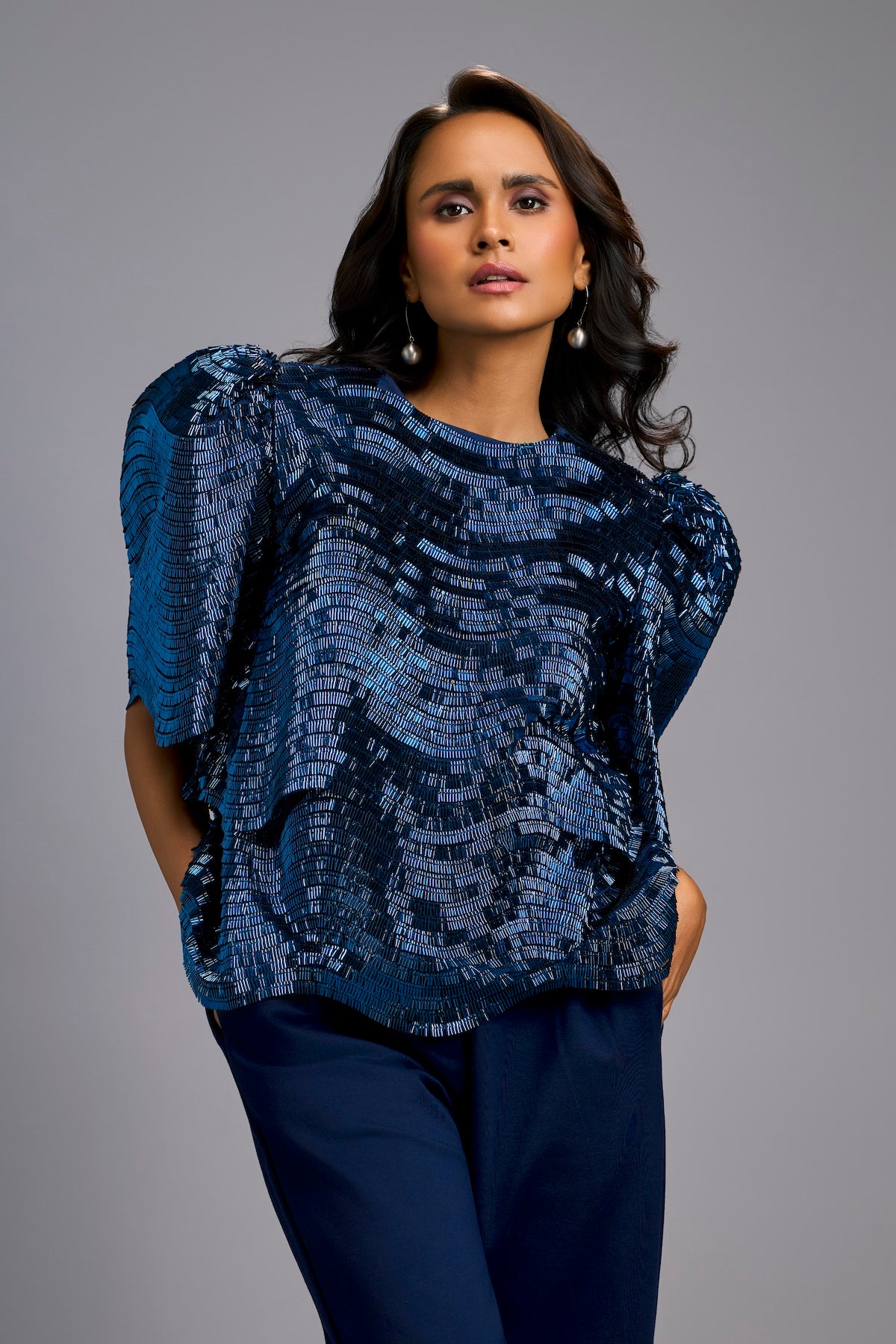 Textured Navy Blue Shimmer Top with Sculptural Shoulders and Cropped Pants