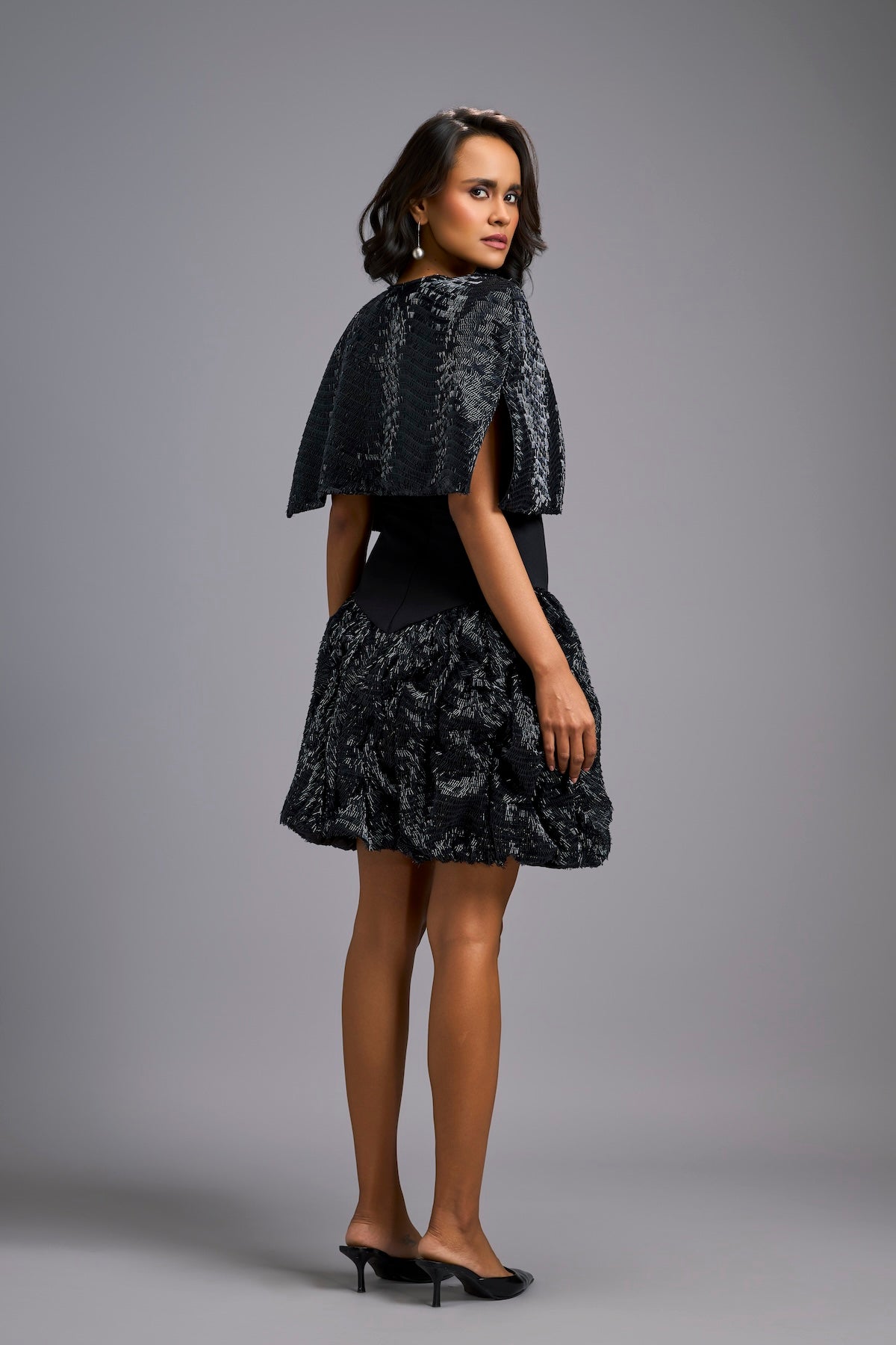 Strapless Black Dress with Voluminous Shimmer Skirt & Cape