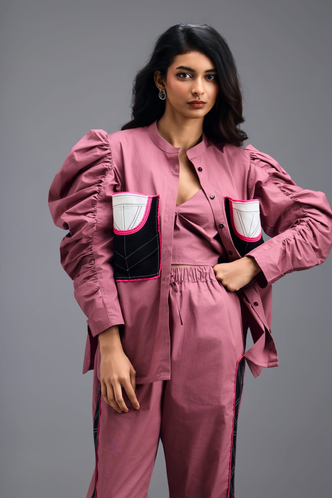 PINK TAILORED PANTS WITH NEON GEOMETRIC POCKET PANEL DETAIL
