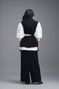 Load image into Gallery viewer, BLACK CO-ORD SET WITH NEON PANELLED VEST, PUFF-SLEEVE SHIRT AND TROUSERS
