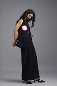 Load image into Gallery viewer, BLACK CO-ORD SET WITH NEON GEOMETRIC PANELLED SLEEVELESS BLAZER, TWISTED TOP AND TROUSERS

